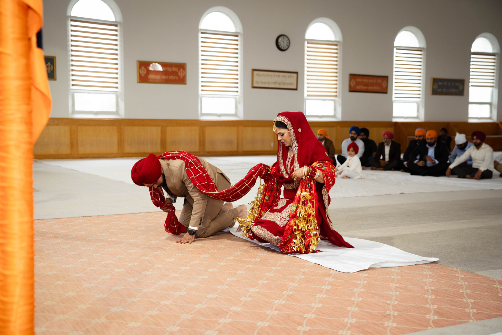 Groom bowing before his bride during the ceremony